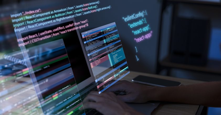 programming-background-with-person-working-with-codes-computer